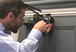 Installing the Freedor free-swing door closer on the pull side of a door